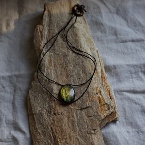 Labradorite and cotton cord necklace. Small chip.